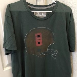 Nike Shirts - Nike Sportswear Miami Hurricanes Helmet T-Shirt Nike Shirts - Nike Sportswear Miami Hurricanes Helmet T-Shirt
